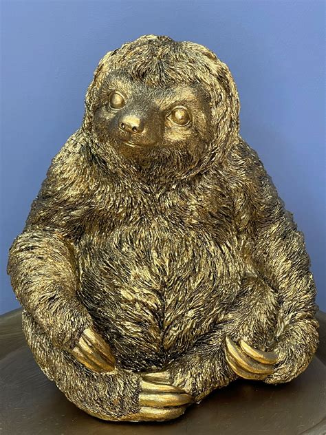 gold sloth statue